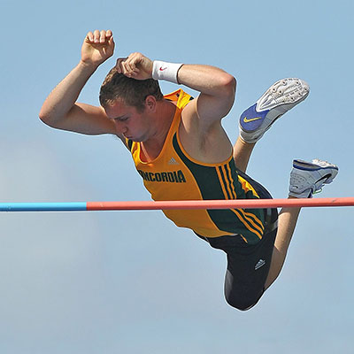 Pole vaulter clearing the bar